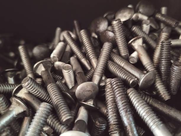A pile of screws and bolts on a table