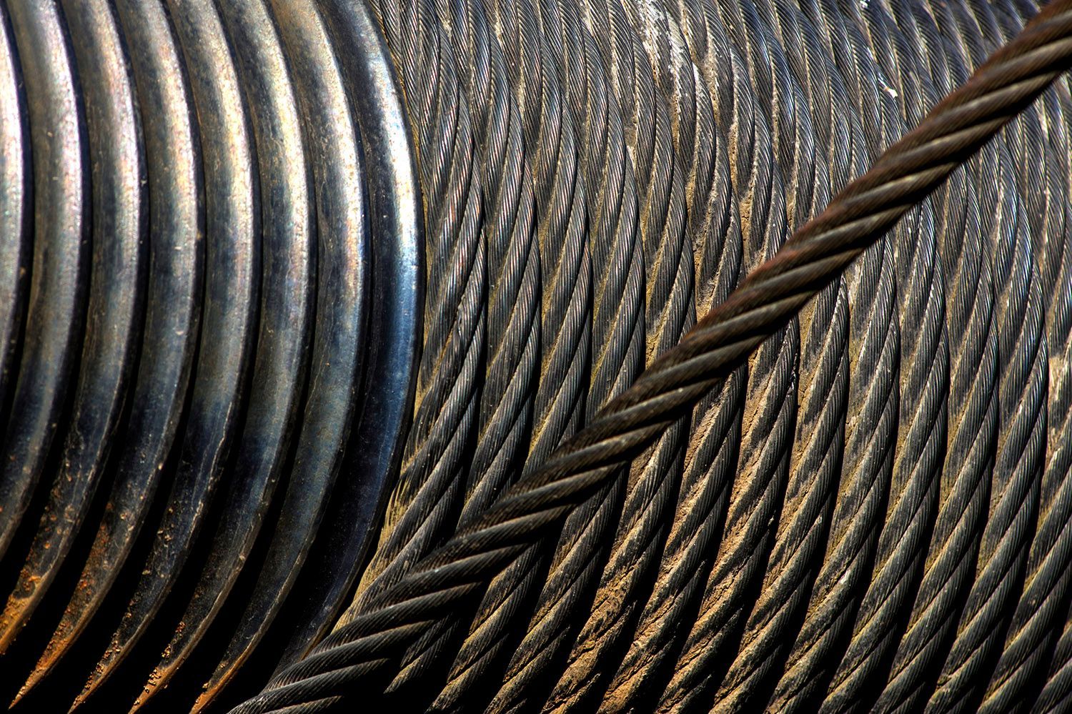 A close up of a spool of steel wire
