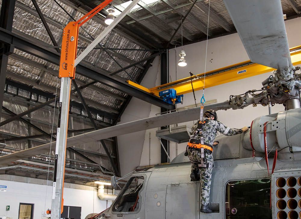 A close up of a person 's hands holding a tool.