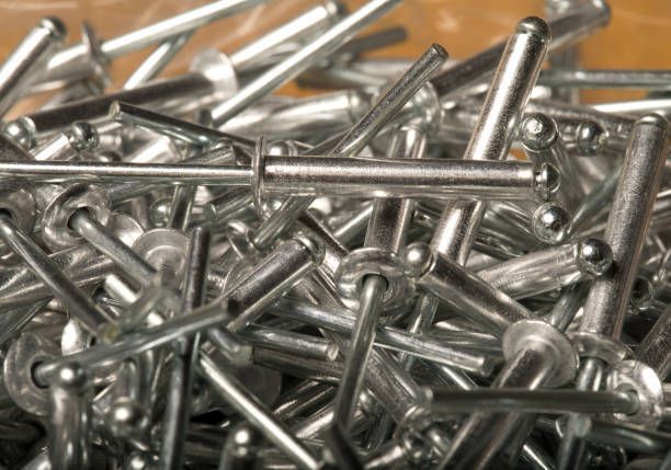 Close up of pop rivets and riveter