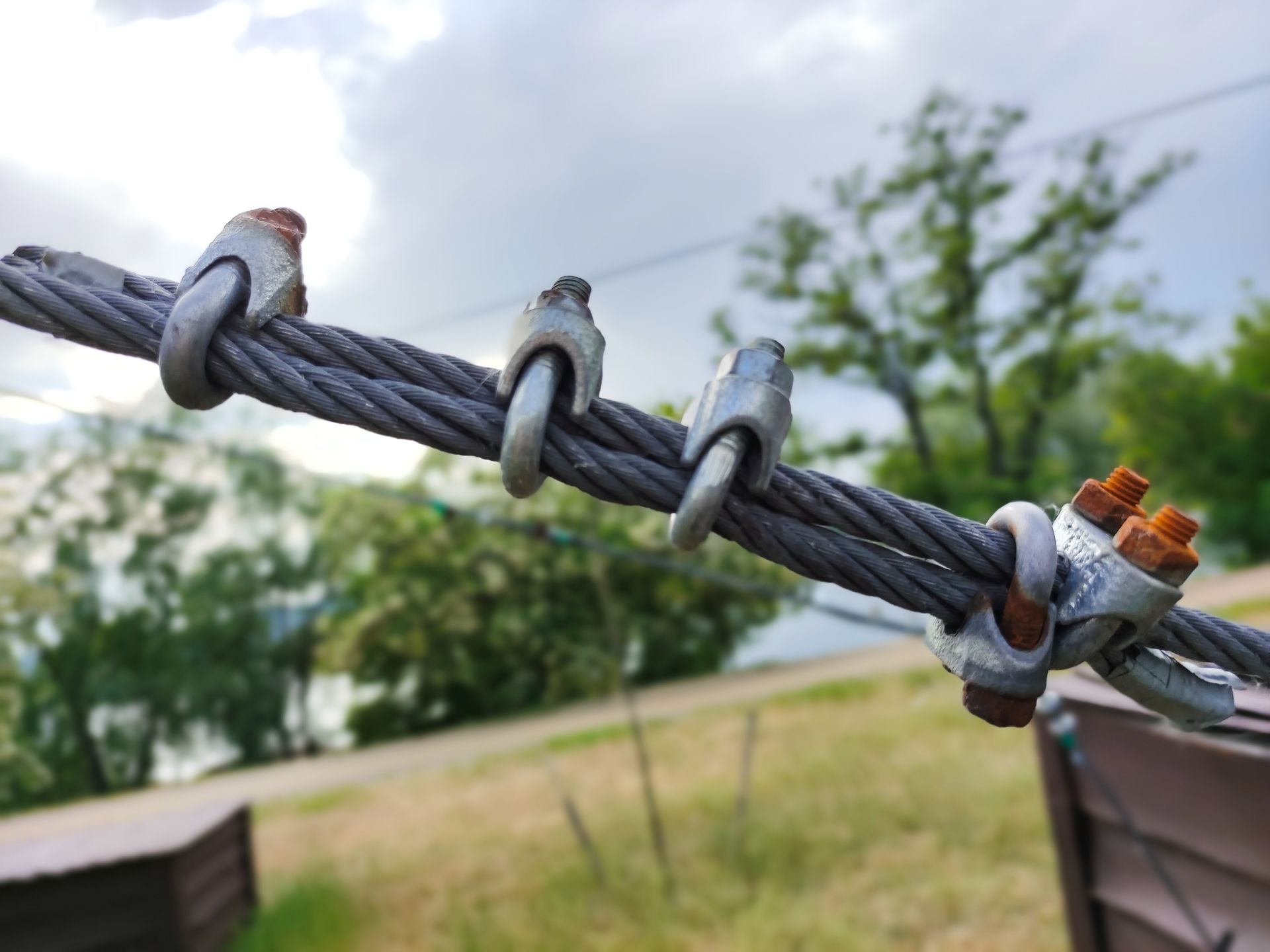 A close up of a crane hook on a construction site.