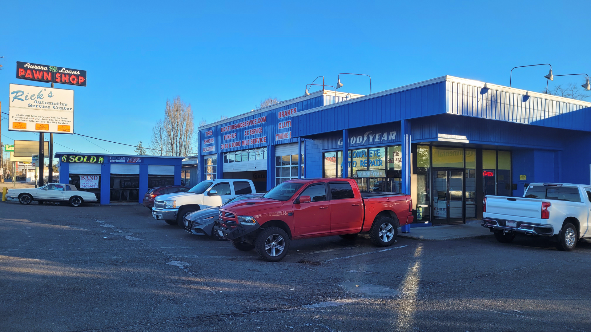 Several Vehicles Parked in Front of Our Tire & Service Center in Seattle, WA | Rick's Tire & Service