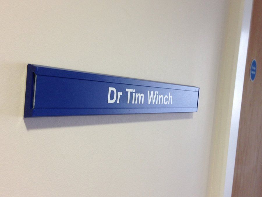 Interchangable aluminium door sign for doctors surgery