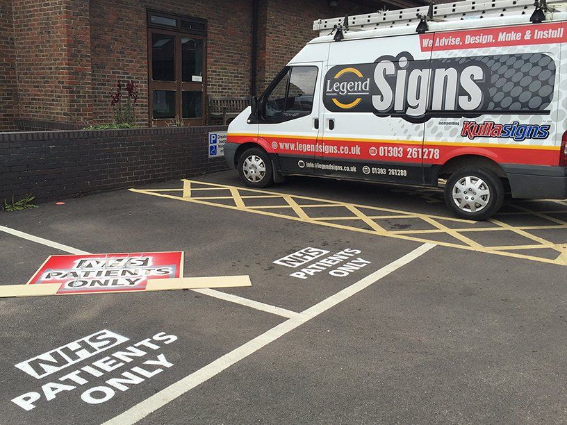 Stenciled NHS Parking Bay Markings