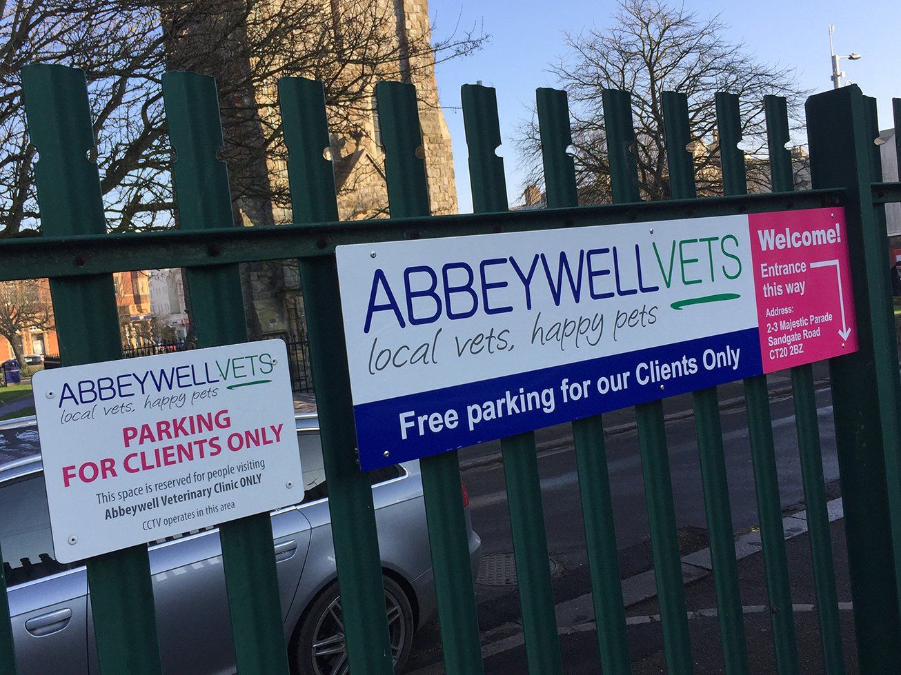 Dibond signs mounted to metal fence