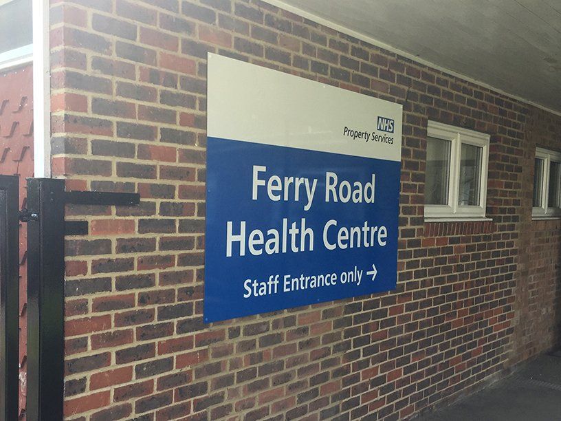wall sign for nhs health centre