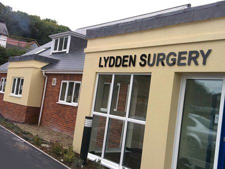 Black acrylic letters mounted on stand off fixings