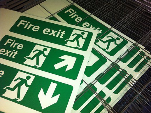 Screen printed photoluminescent Fire Exit signs
