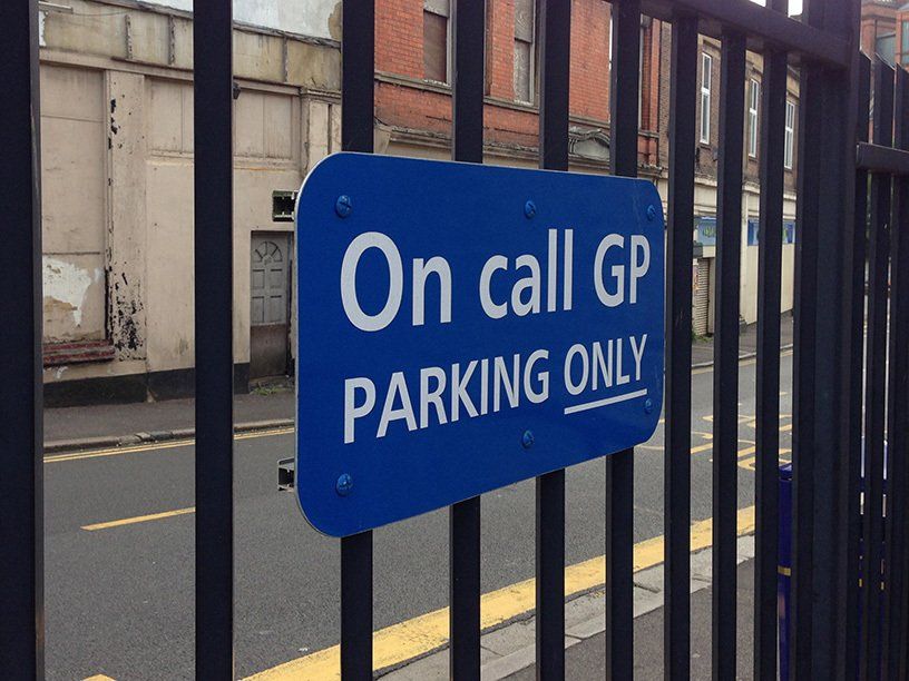sign mounted on railings