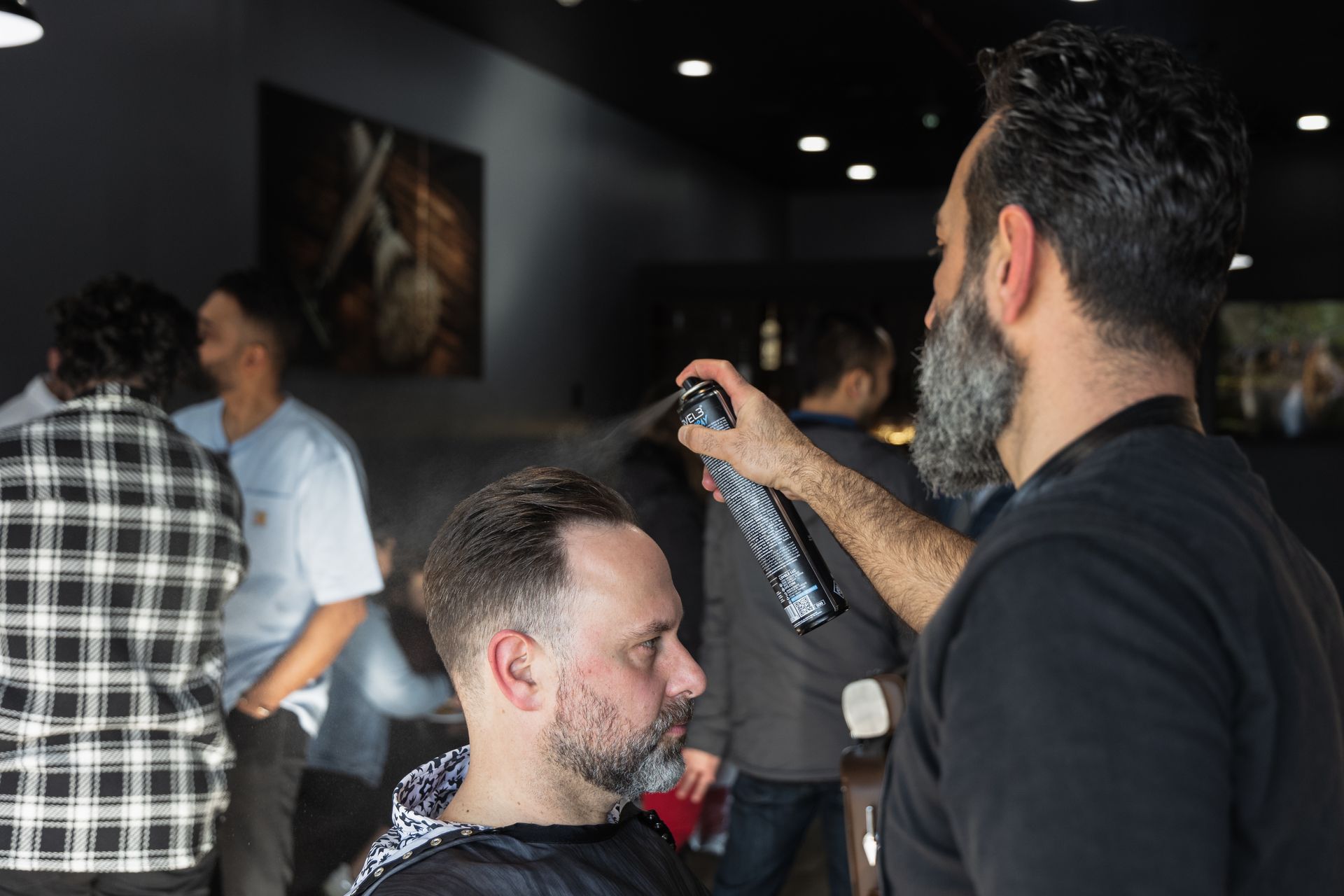 a man with glasses and a beard is wearing a white shirt