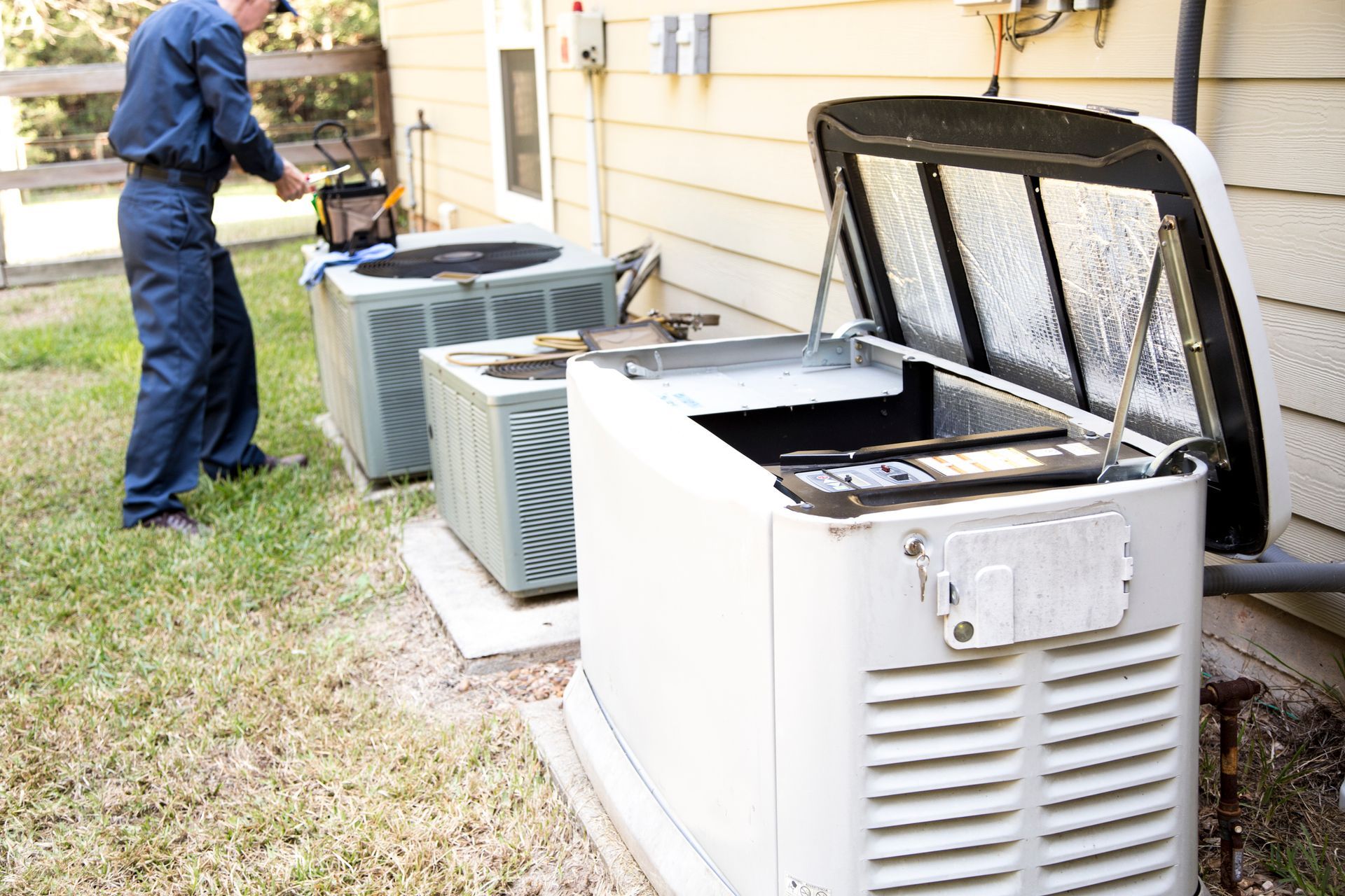 HVAC contractor servicing AC units for optimal performance.
