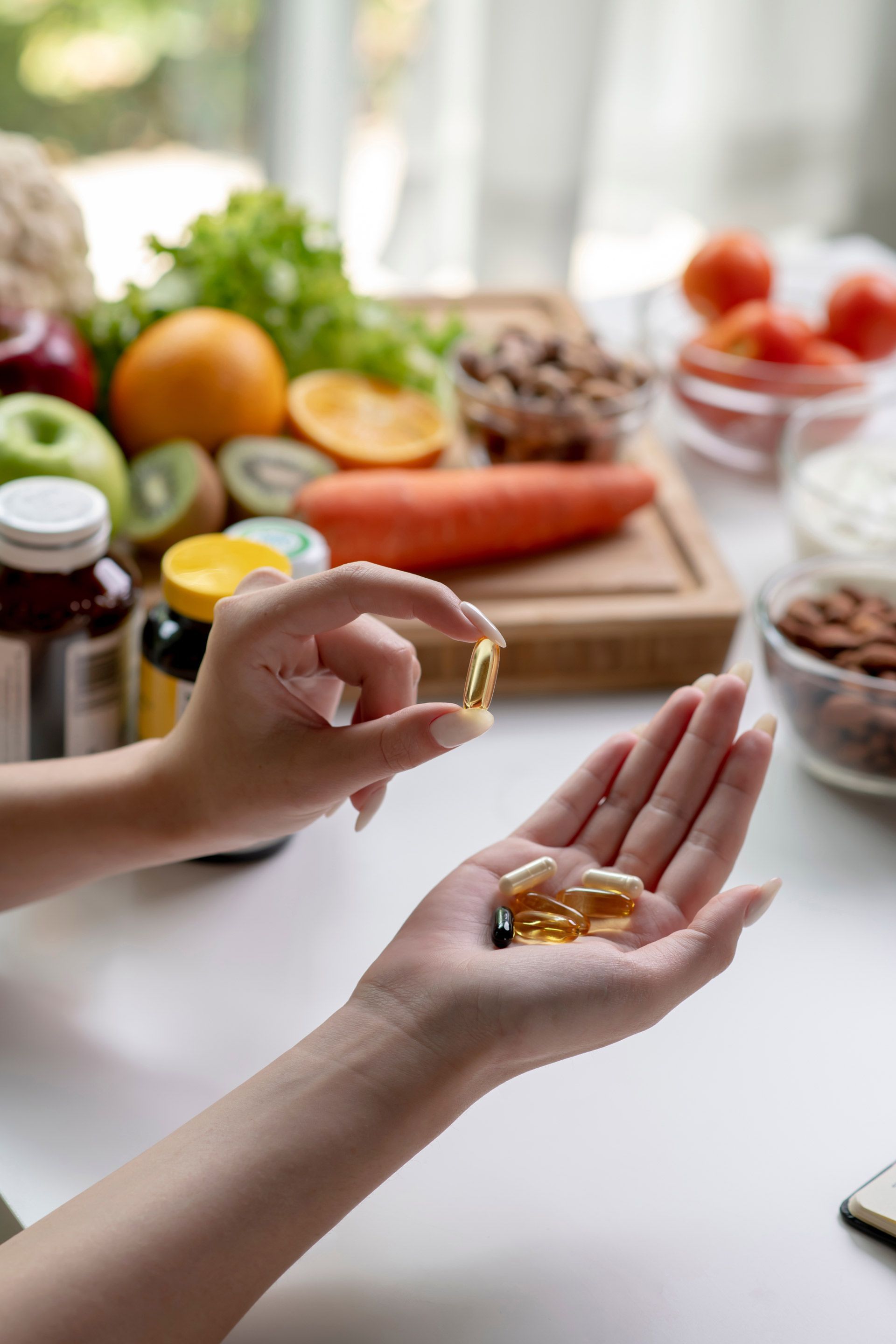 A woman is taking a pill from a bottle in her hand.