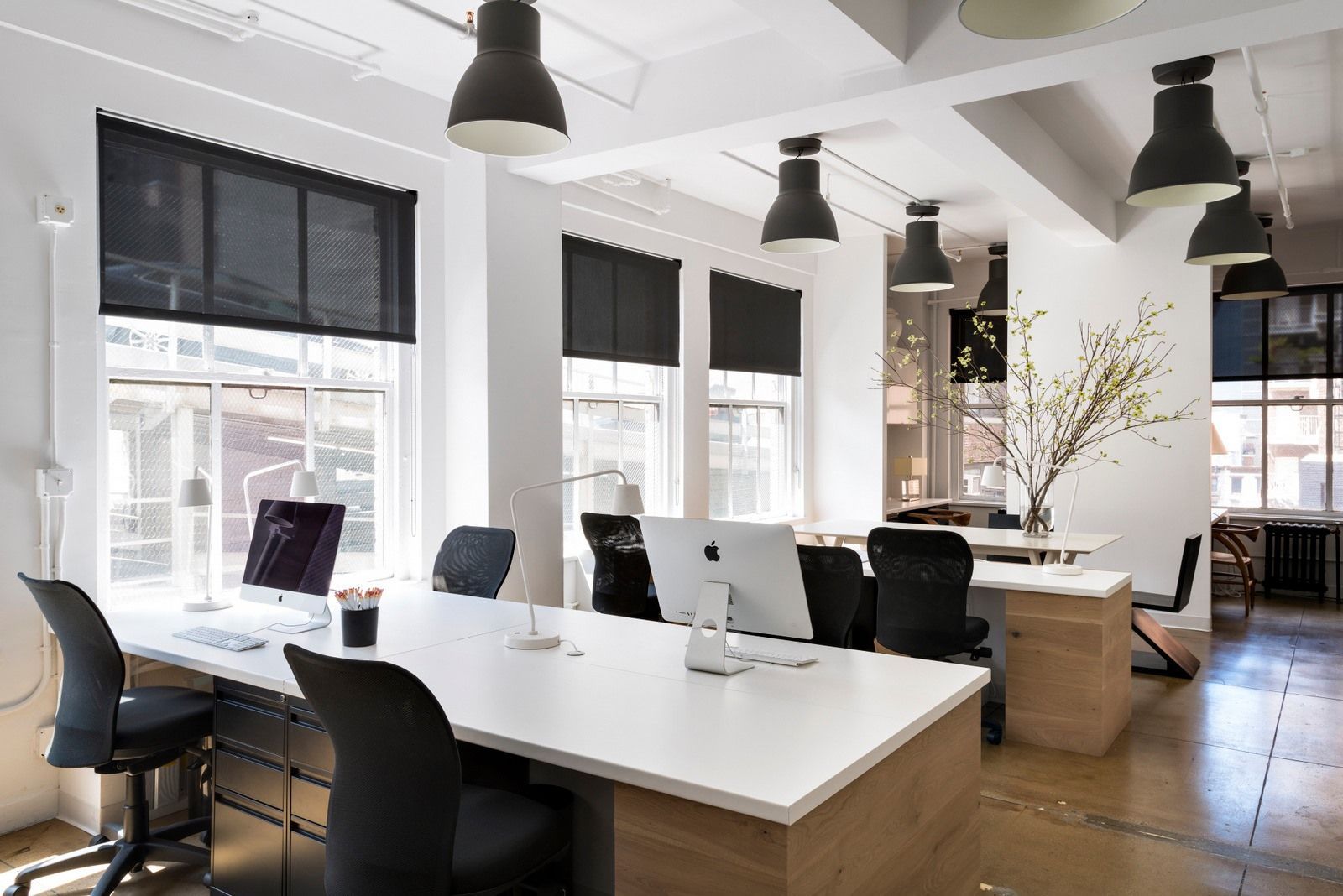 A large office with a lot of desks and chairs