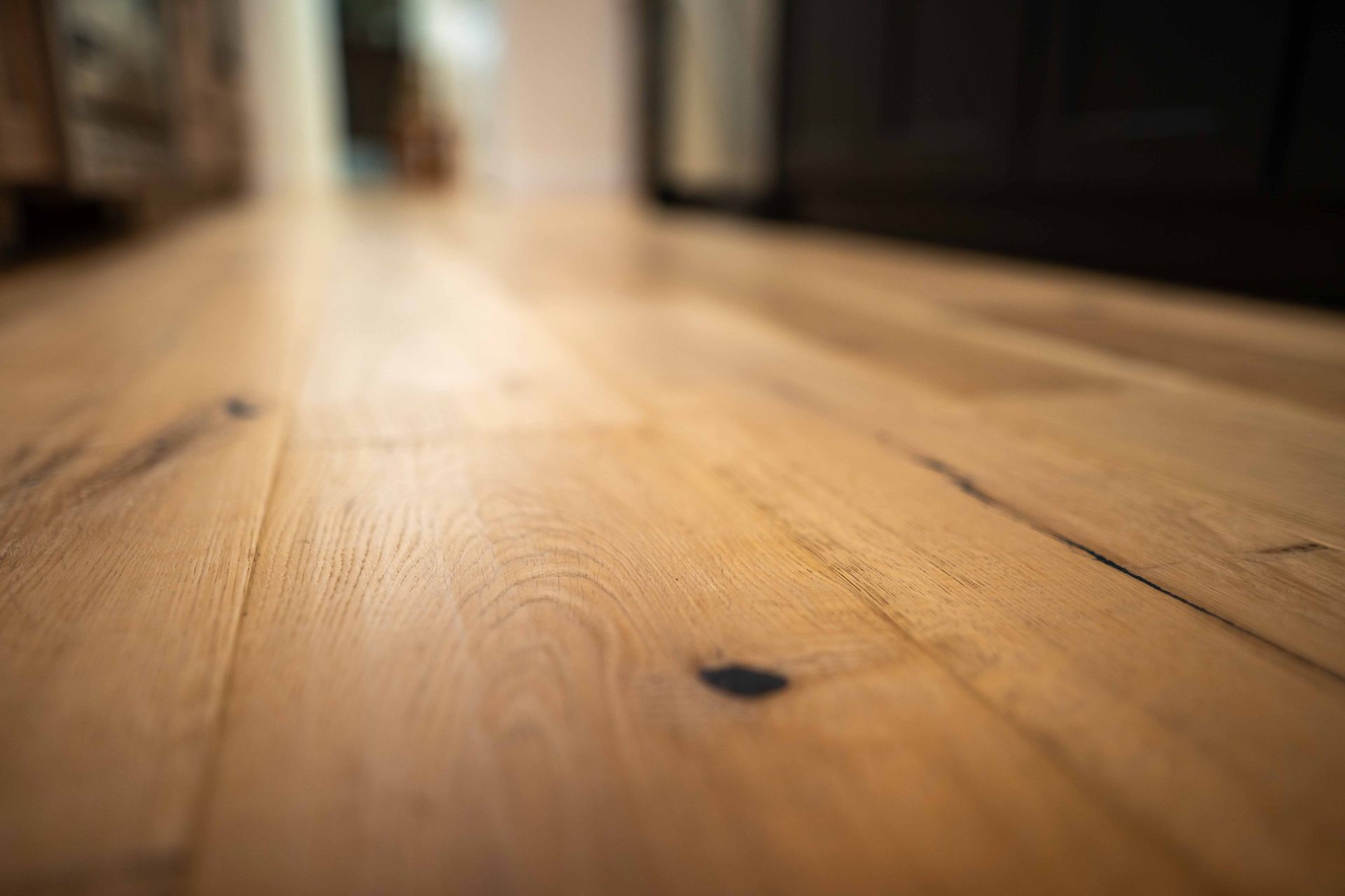 A close up of a wooden floor in a room.