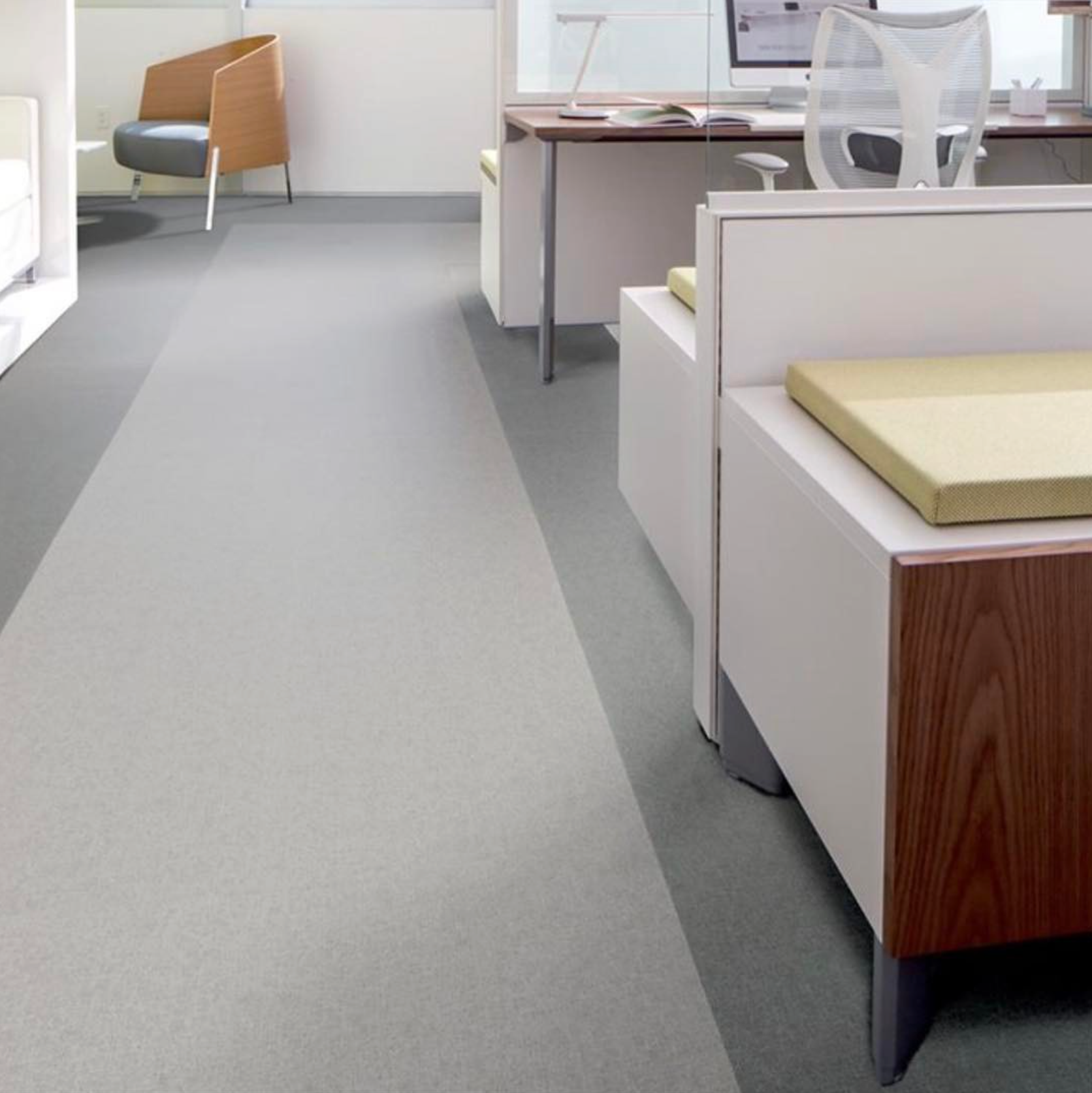 A room with a chair and a desk in it