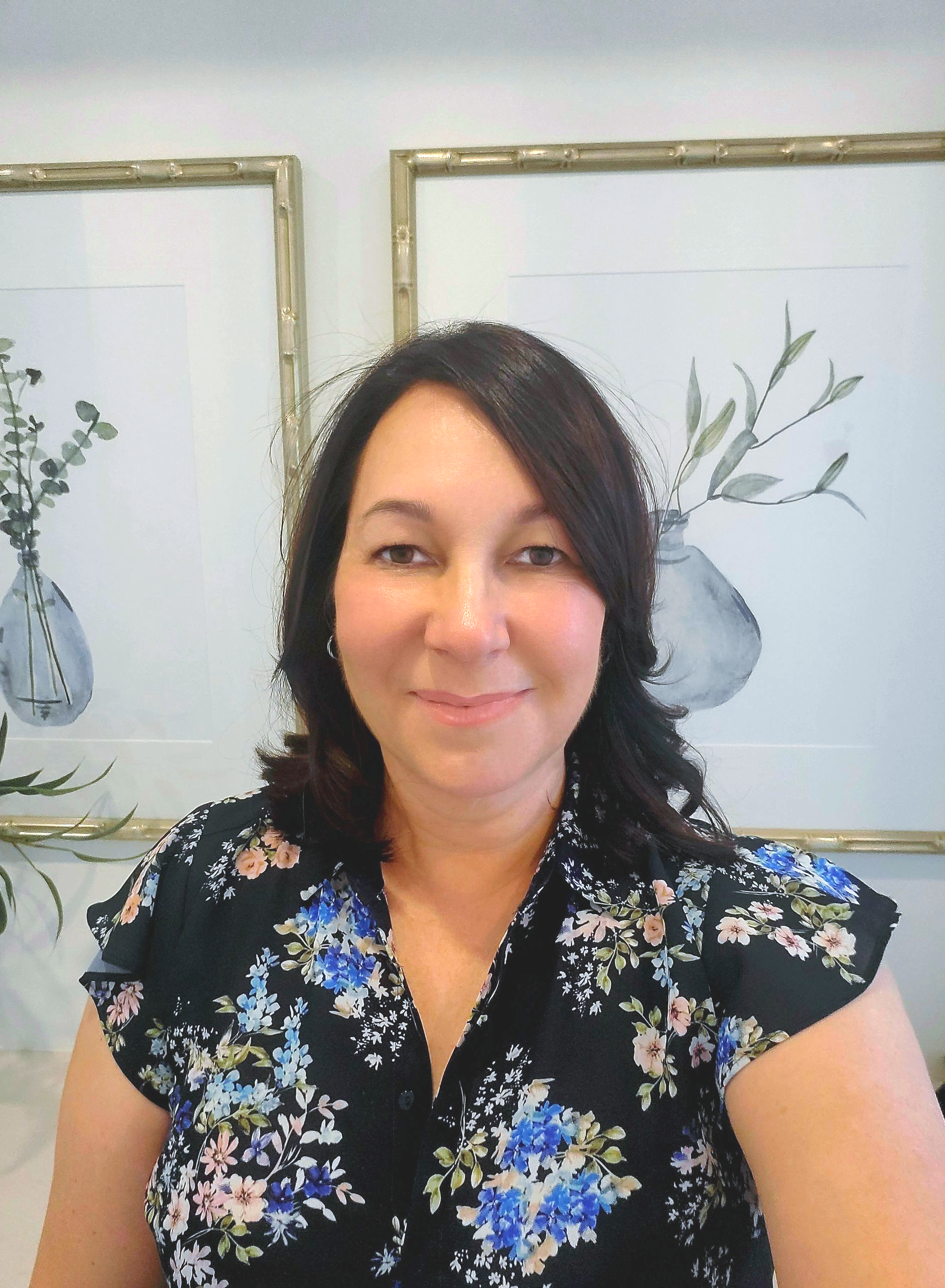 Light Blue Wall With Wooden Bench, Teal Table, Hat, and Plants — Jodi Maree Interiors in Dubbo, NSW