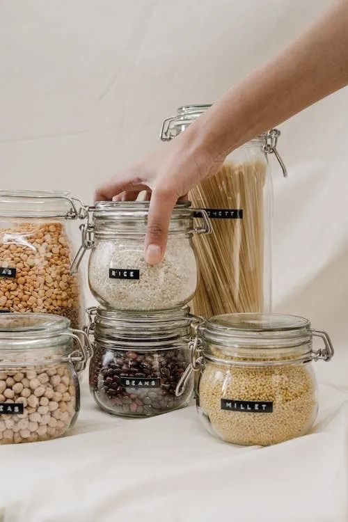 Person's Hand Reaching for a Jar of Rice — Jodi Maree Interiors in Dubbo, NSW