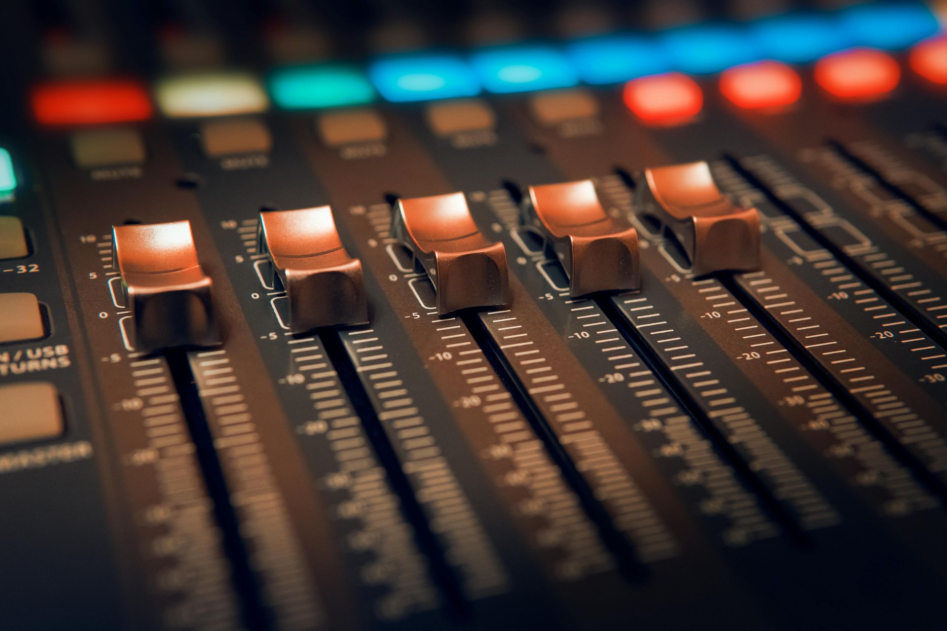 A close up of a mixer with buttons and sliders