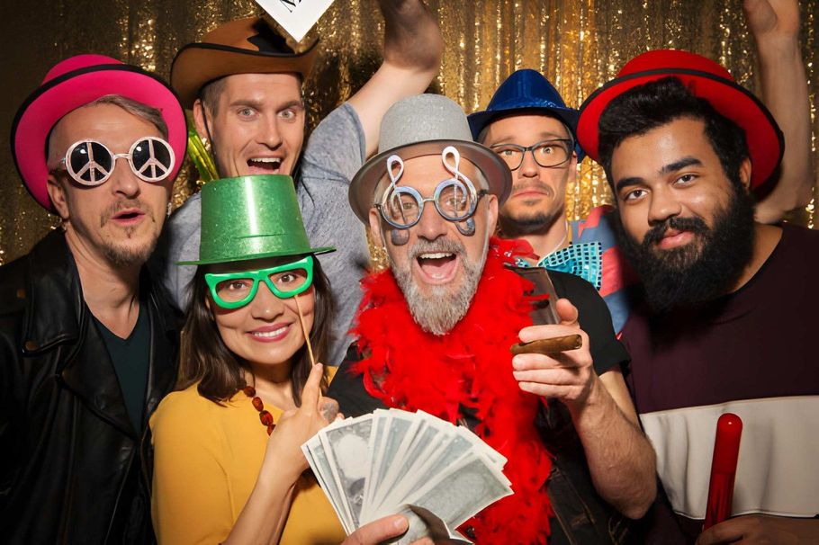 Friends wearing funny glasses at a photo booth event.