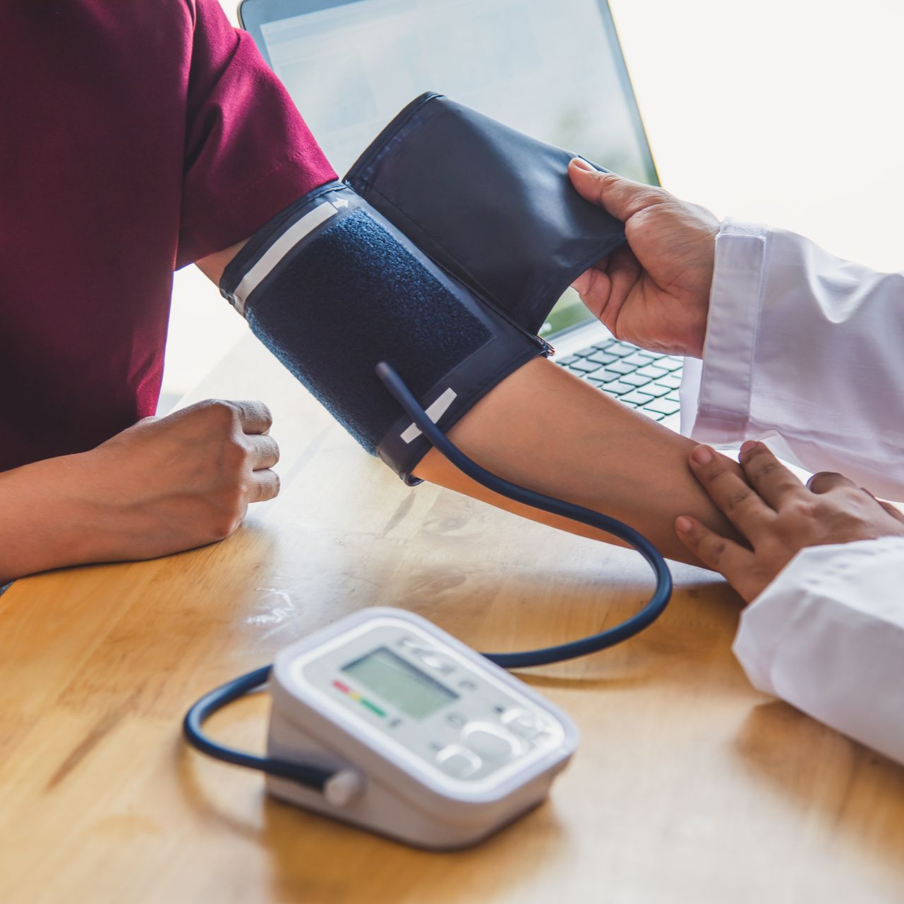Patient having blood pressure measured at Ashworths Clinic Ashford.
