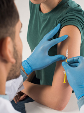 A patient getting a flu vaccination at Ashworths Clinic in Ashford, Kent.