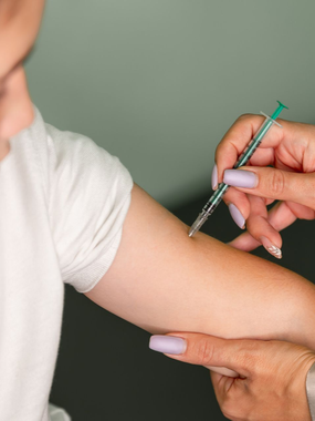 A patient getting a travel vaccination at Ashworths Clinic in Ashford, Kent, before leaving for a trip.