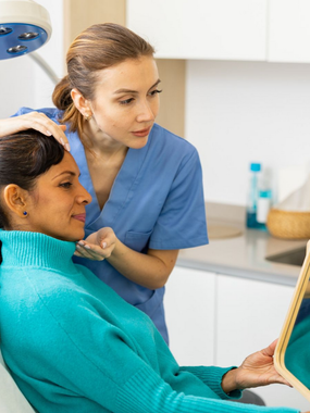 A patient is having her skin consultation at Ashworths Clinic in Ashford, Kent.