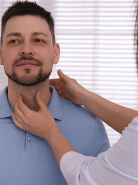 A patient getting his throat checked at Ashworths Clinic in Ashford, Kent.