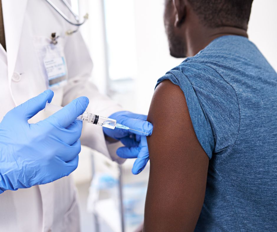 Traveller receiving a vaccination at Ashworths Clinic before an overseas trip.