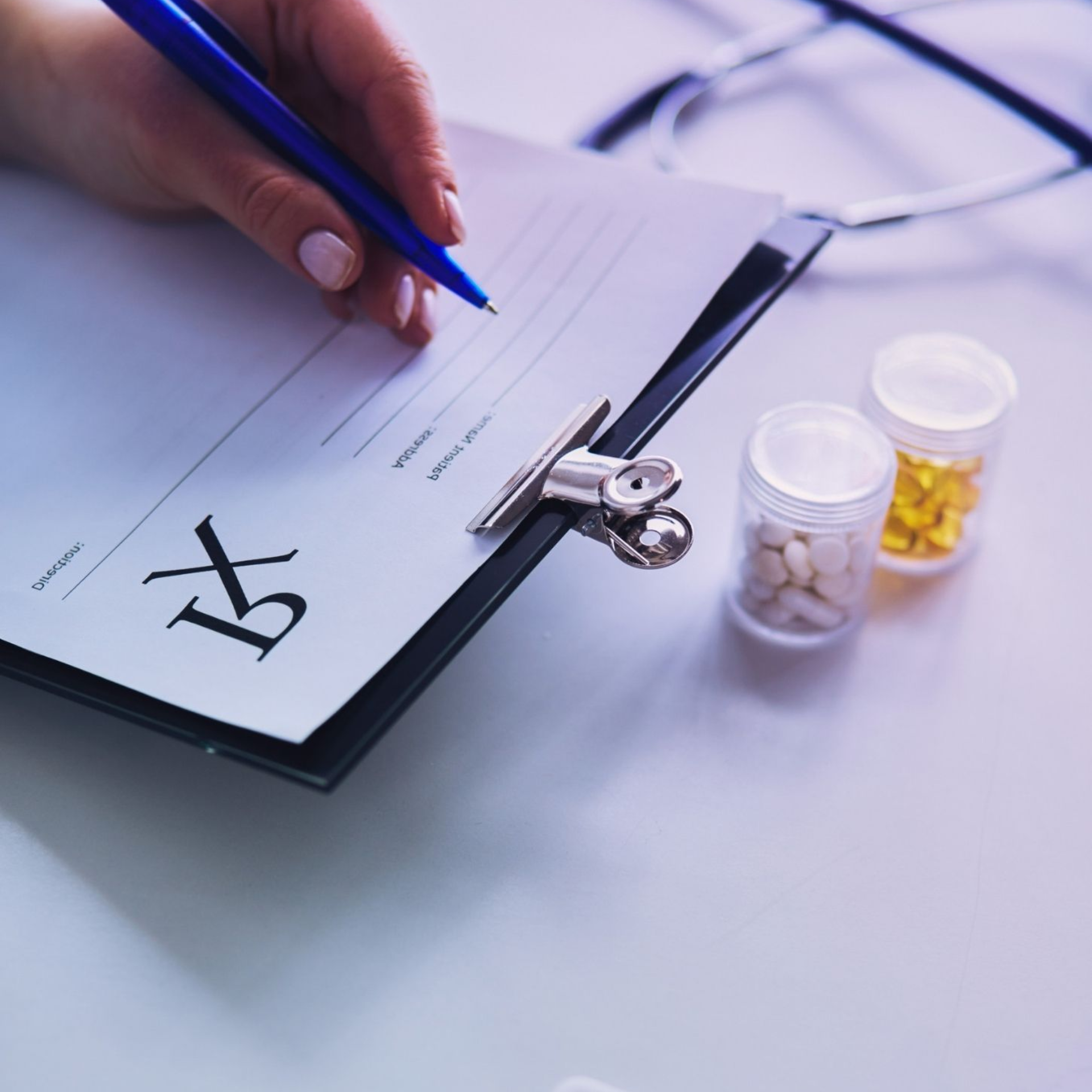 Clinician writing a private prescription at Ashworths Clinic Ashford.