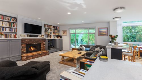 A living room filled with furniture and a fireplace.