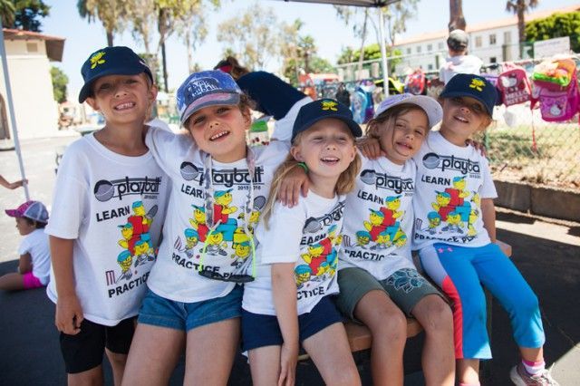 A group of young girls wearing shirts that say play