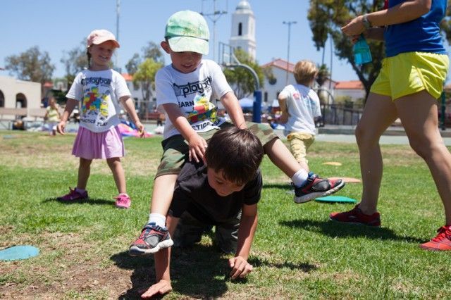 A group of children are playing in a park.