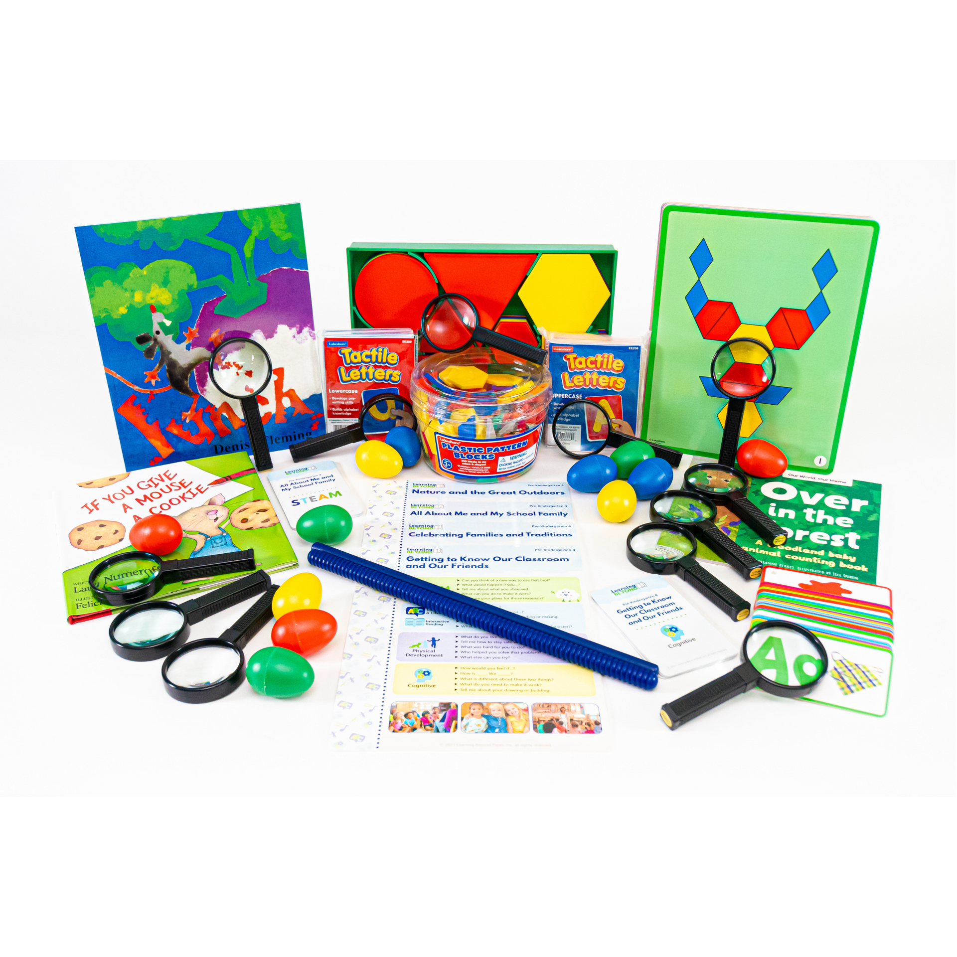 A table topped with a variety of children 's toys including magnifying glasses and scissors.