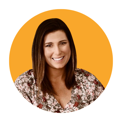 A woman in a floral shirt is smiling in an orange circle