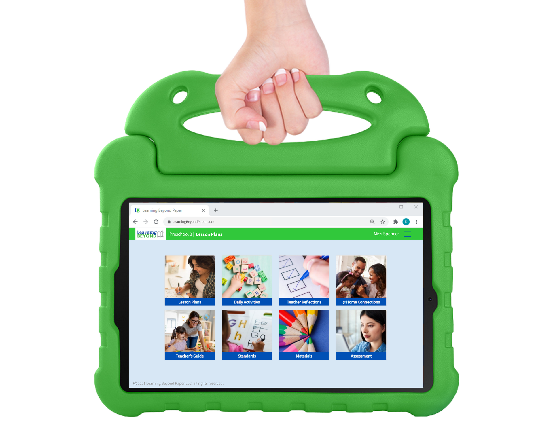 A person is holding a tablet in a green case