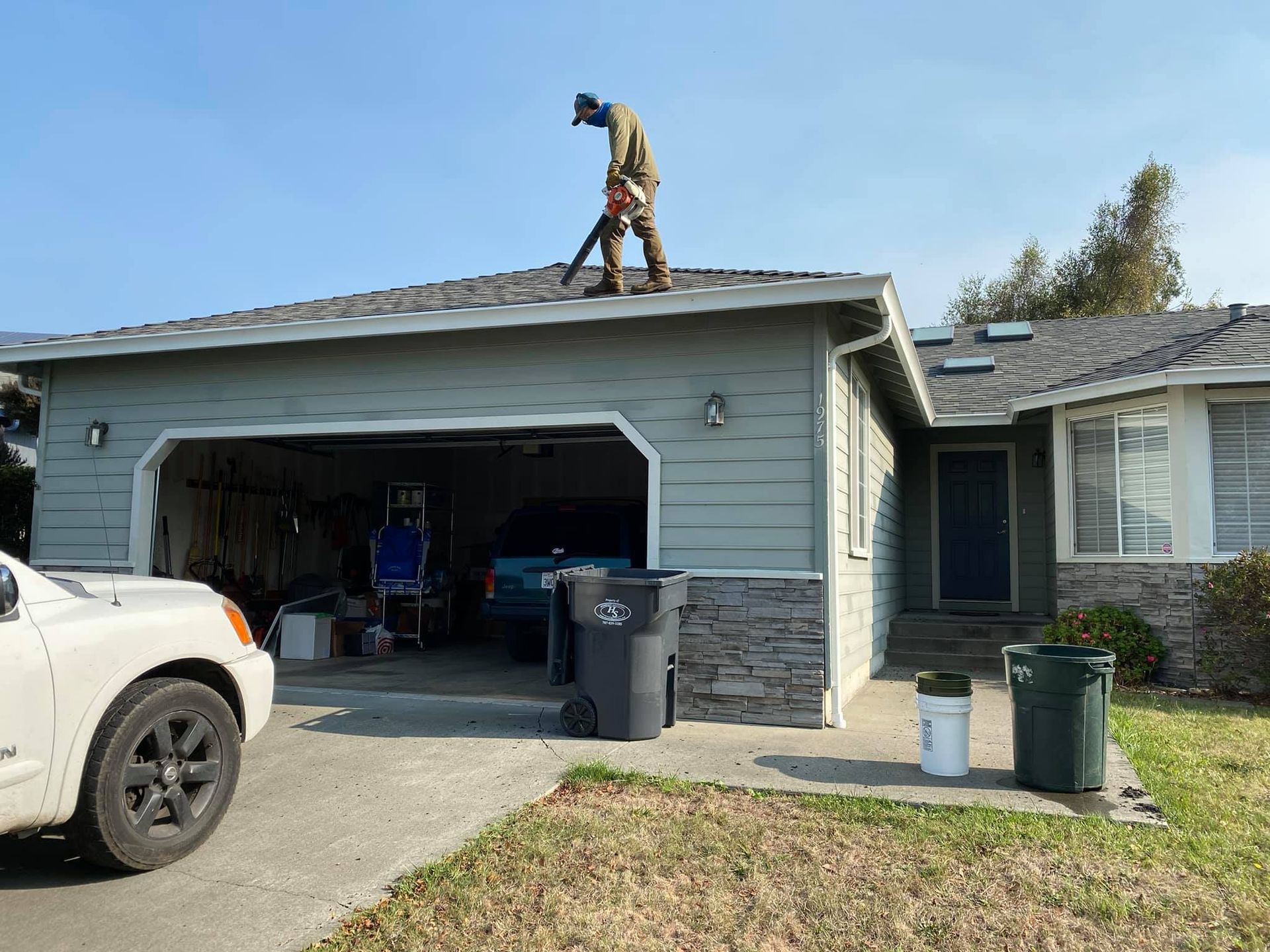 Man In Gloves Cut Branches Using Chainsaw - Arcata, CA - Ciotti Yard Maintenance