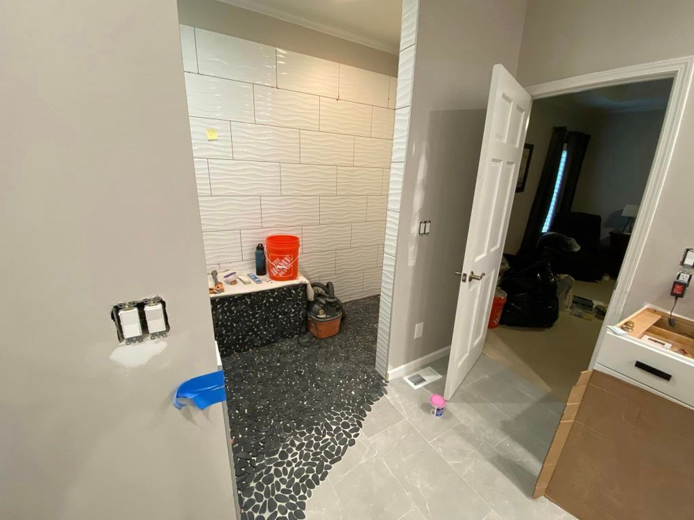 A bathroom under construction with a bathtub and a sink.