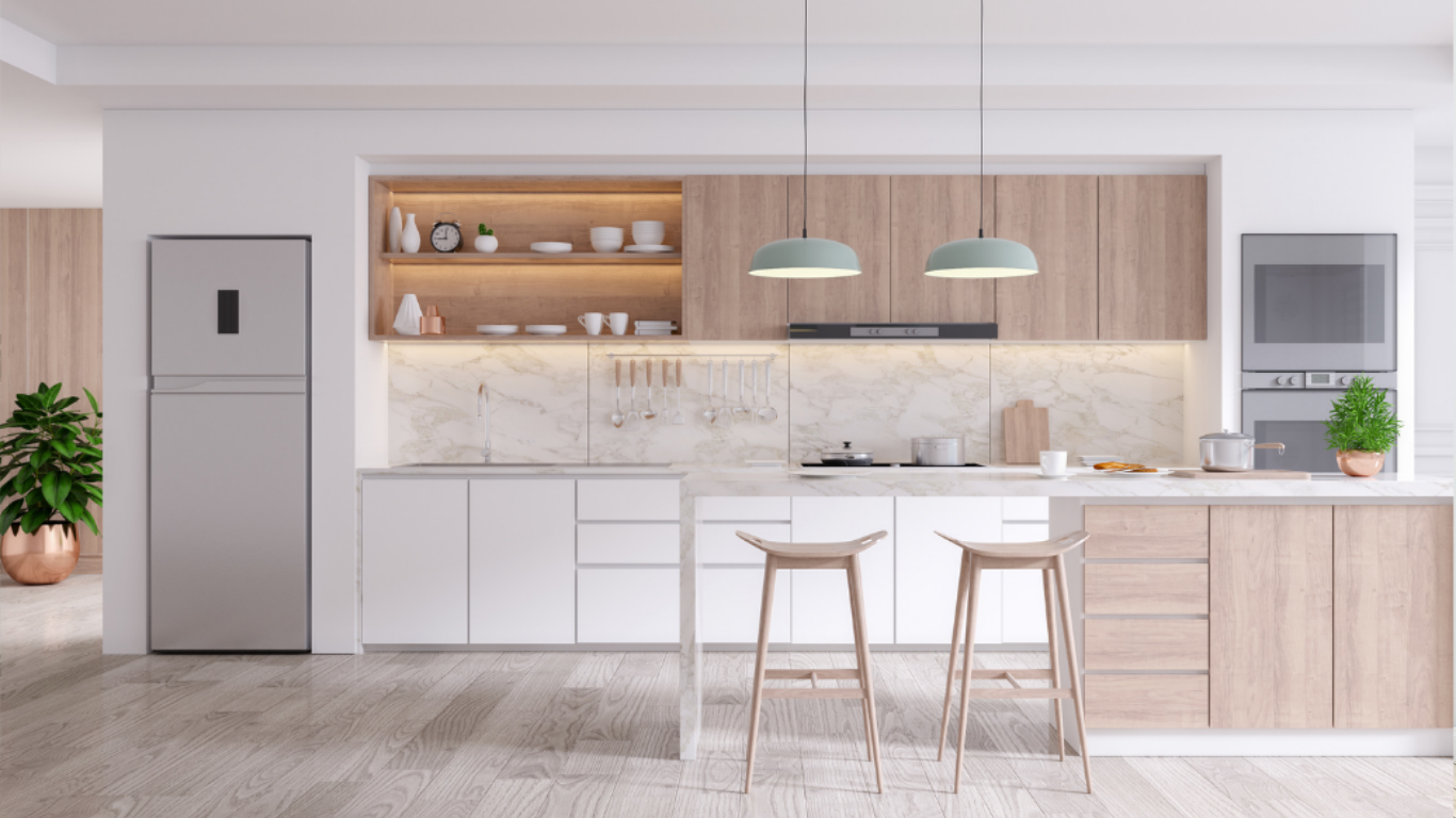 A kitchen with white cabinets , wooden cabinets , stools , a refrigerator and a microwave.