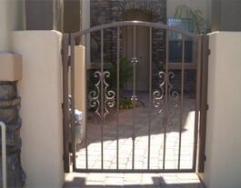 Curved Iron — Brown Steel Fence in Mesa, AZ