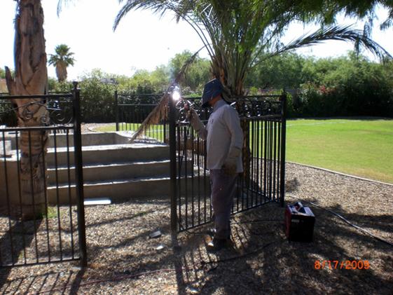 Welded — Man Working On Fence in Mesa, AZ