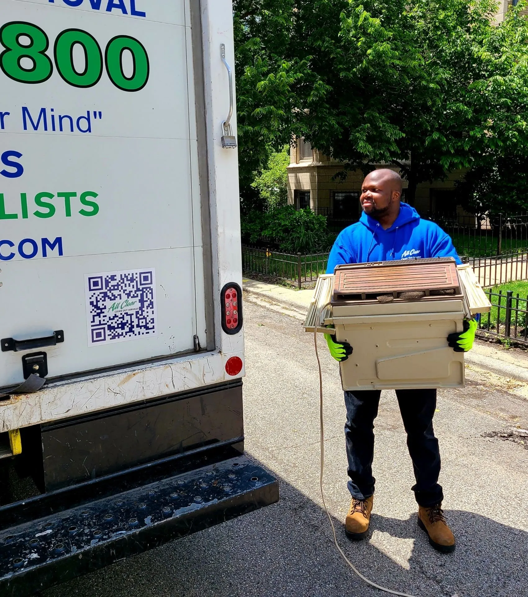 Man Holding Junk — Chicago, Suburbs, & Northwest Indiana — All Clear Clean Out & Junk Removal Services
