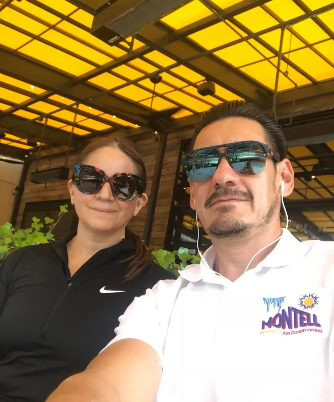 A man and a woman wearing sunglasses and a shirt that says montel
