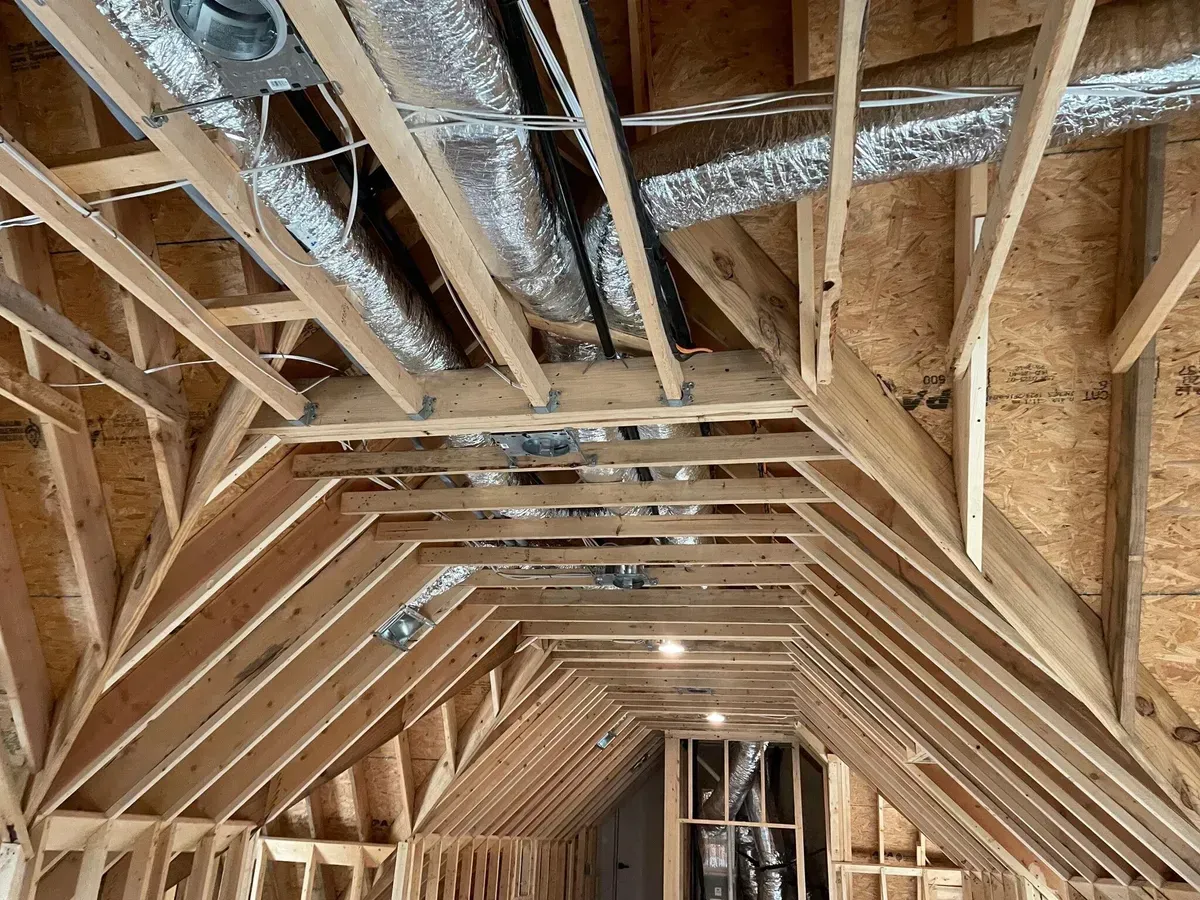 A picture of the ceiling of a house under construction.