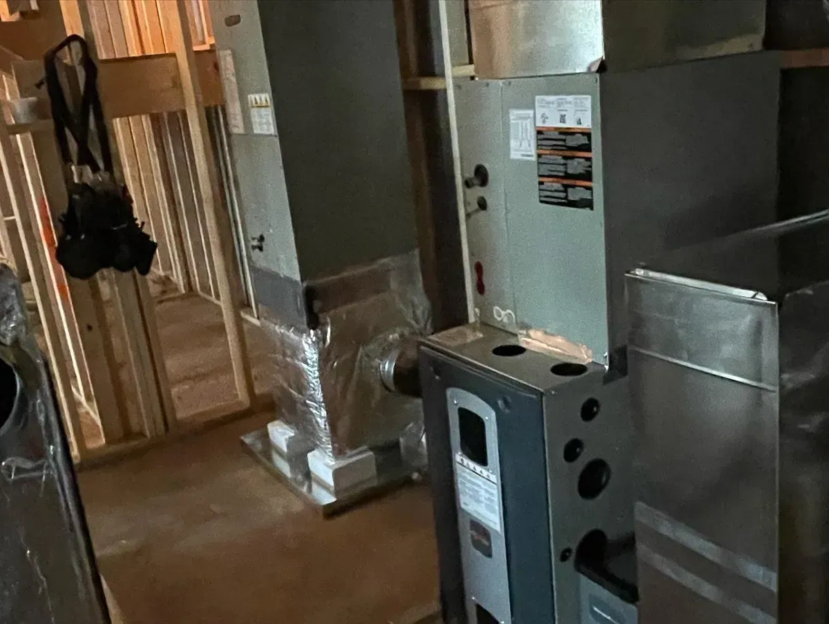 A room with a lot of appliances in it and a camera hanging on the wall.