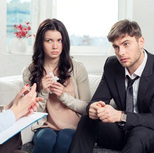 A young couple in a mediation session