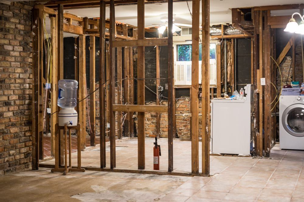A Basement Under Construction With a Washer and Dryer — Peterson Property Valuations In Caloundra West, QLD