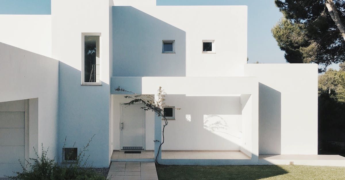 White Modern House With Geometric Shapes — Peterson Property Valuations In Caloundra West, QLD