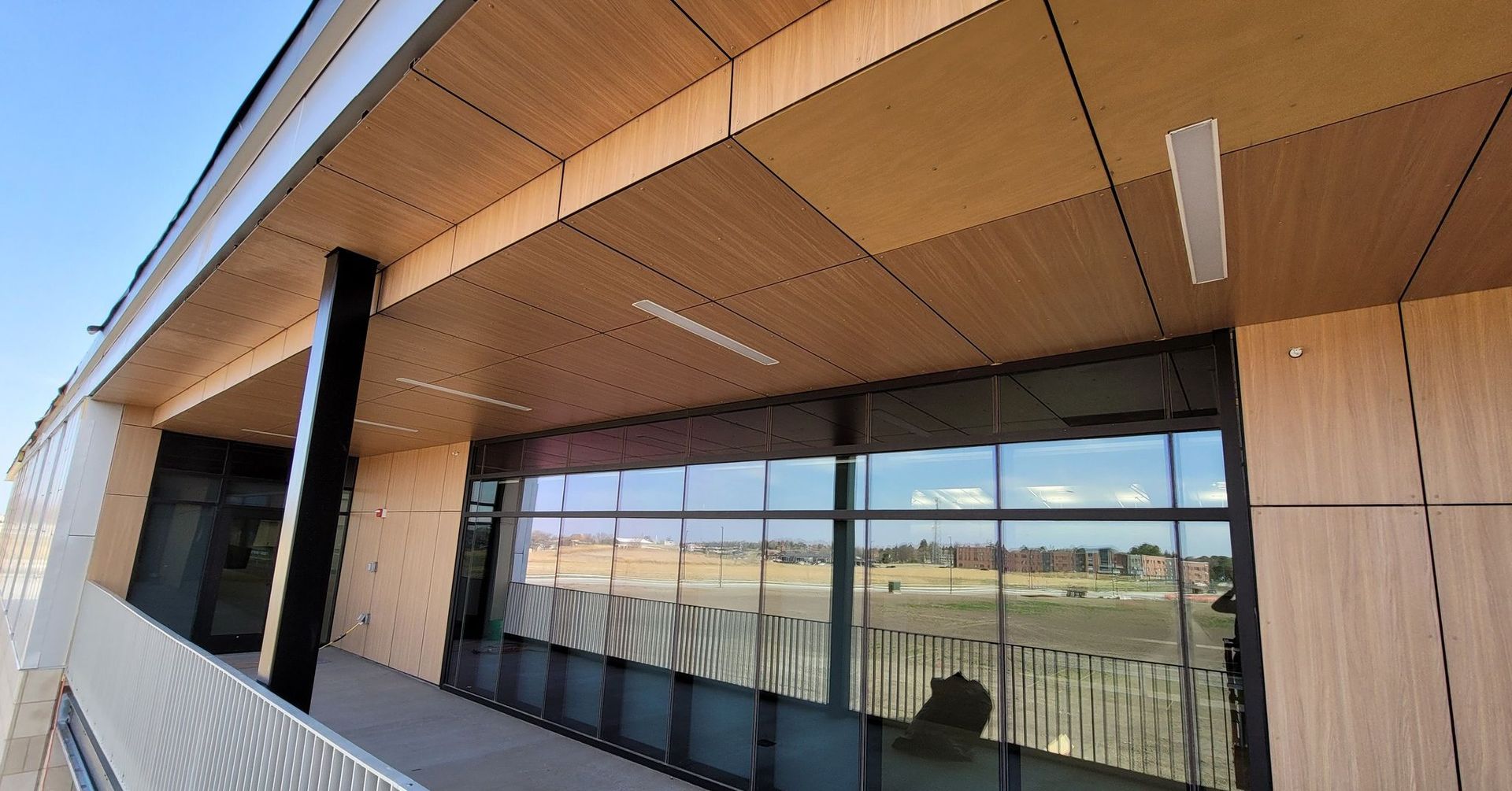 A building with a lot of windows and a wooden ceiling