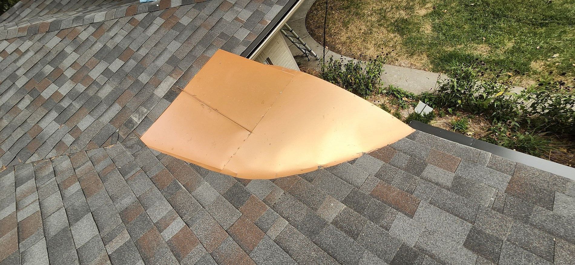 A piece of foam is sitting on top of a roof.